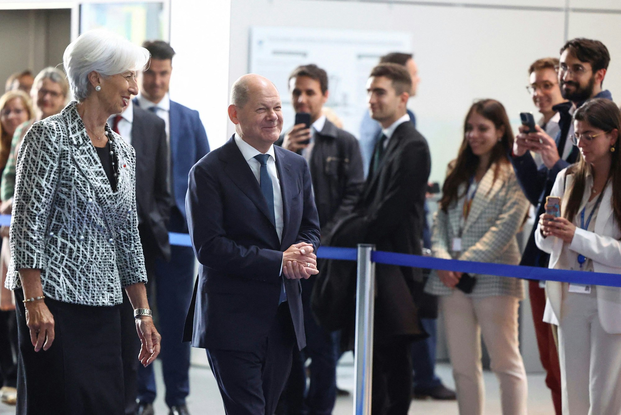 European Central Bank president Christine Lagarde, left, walks with German Chancellor Olaf Scholz attends a ceremony to celebrate the 25th anniversary of the European Central Bank, in Frankfurt, Germany, Wednesday May 24, 2023. (Kai Pfaffenbach/Pool via AP)