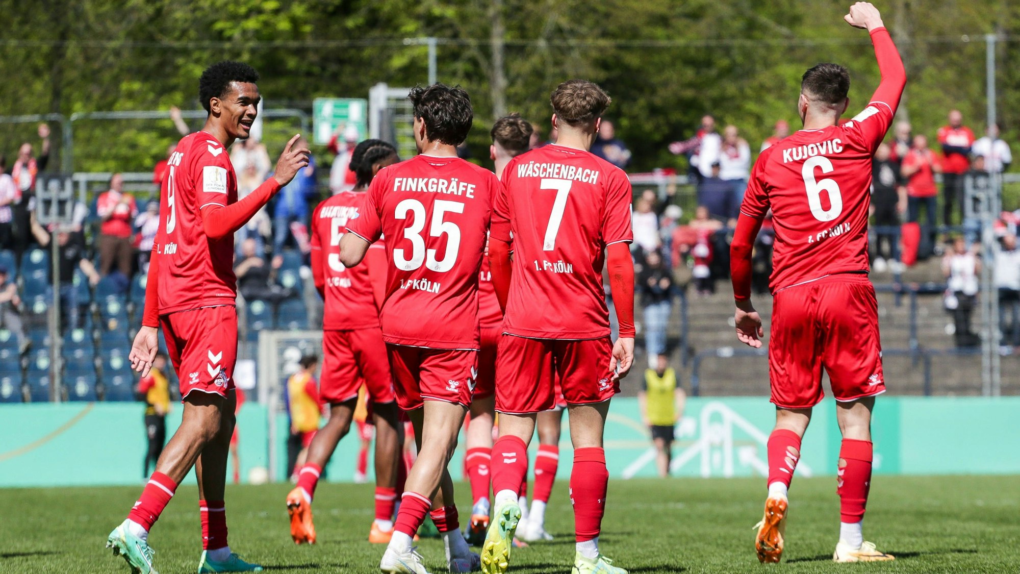 Damion Downs, Max Finkgräfe, Meiko Wäschenbach und Emin Kujovic jubeln