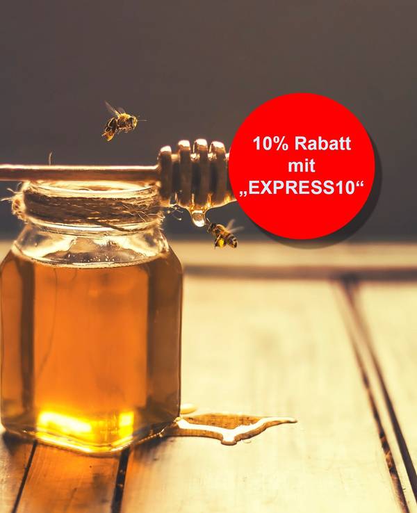 Indoor shot of a jar of honey with honey dripping from a honey dripper and flying bees