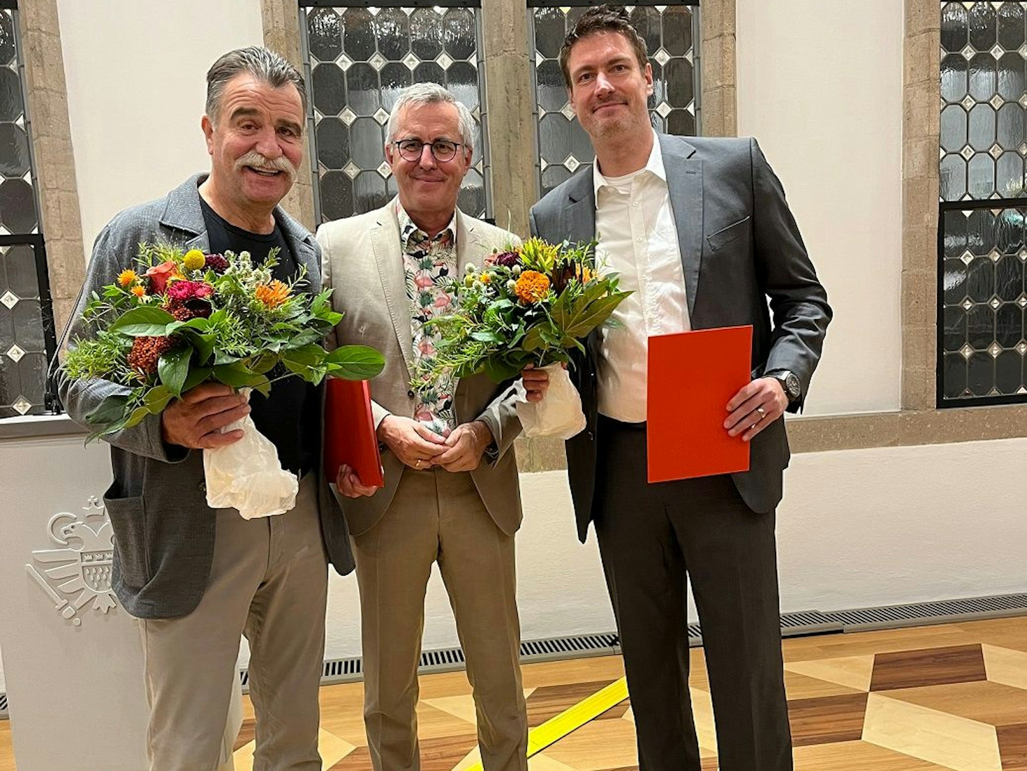 Heiner Brand, Andreas Wolter und Carsten Lichtlein im Rathaus.