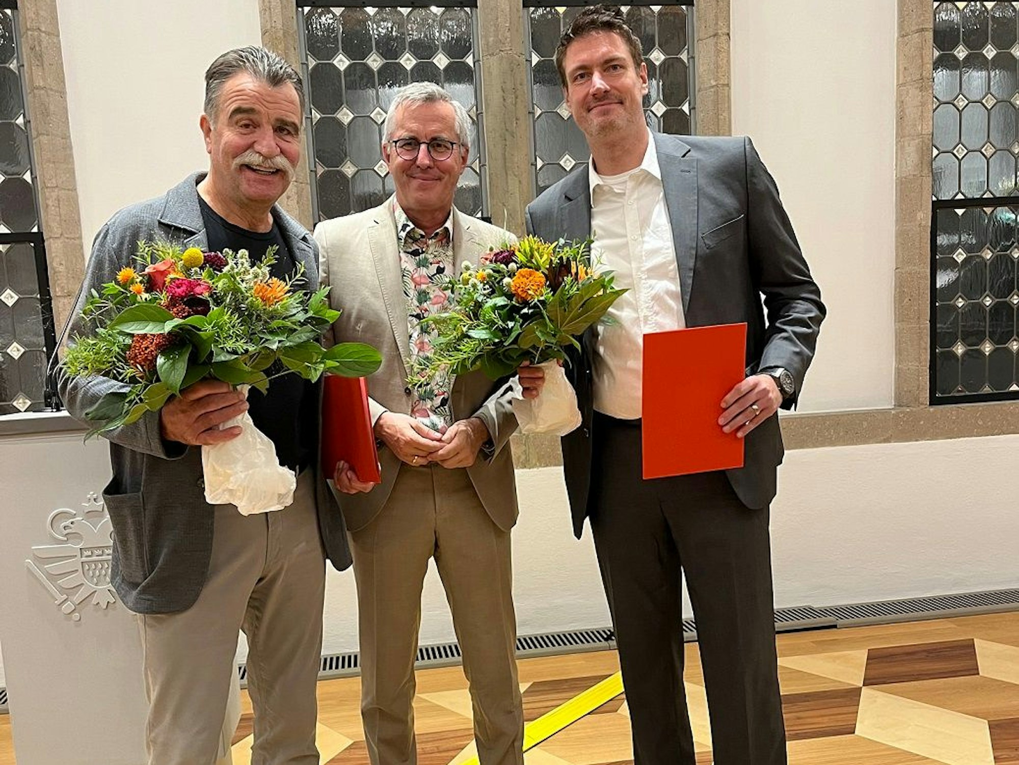 Heiner Brand, Andreas Wolter und Carsten Lichtlein im Rathaus.