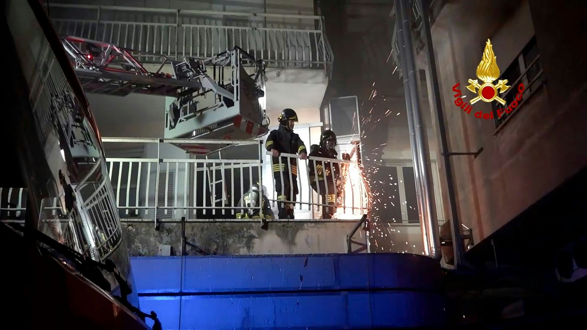 Italian Firefighters work on the balcony of a building of the San Giovanni Evangelista Hospital after a fire broke out causing the death of four people in Tivoli, Italy Thursday, Dec. 8, 2023. (Italian Firefighters Via AP)