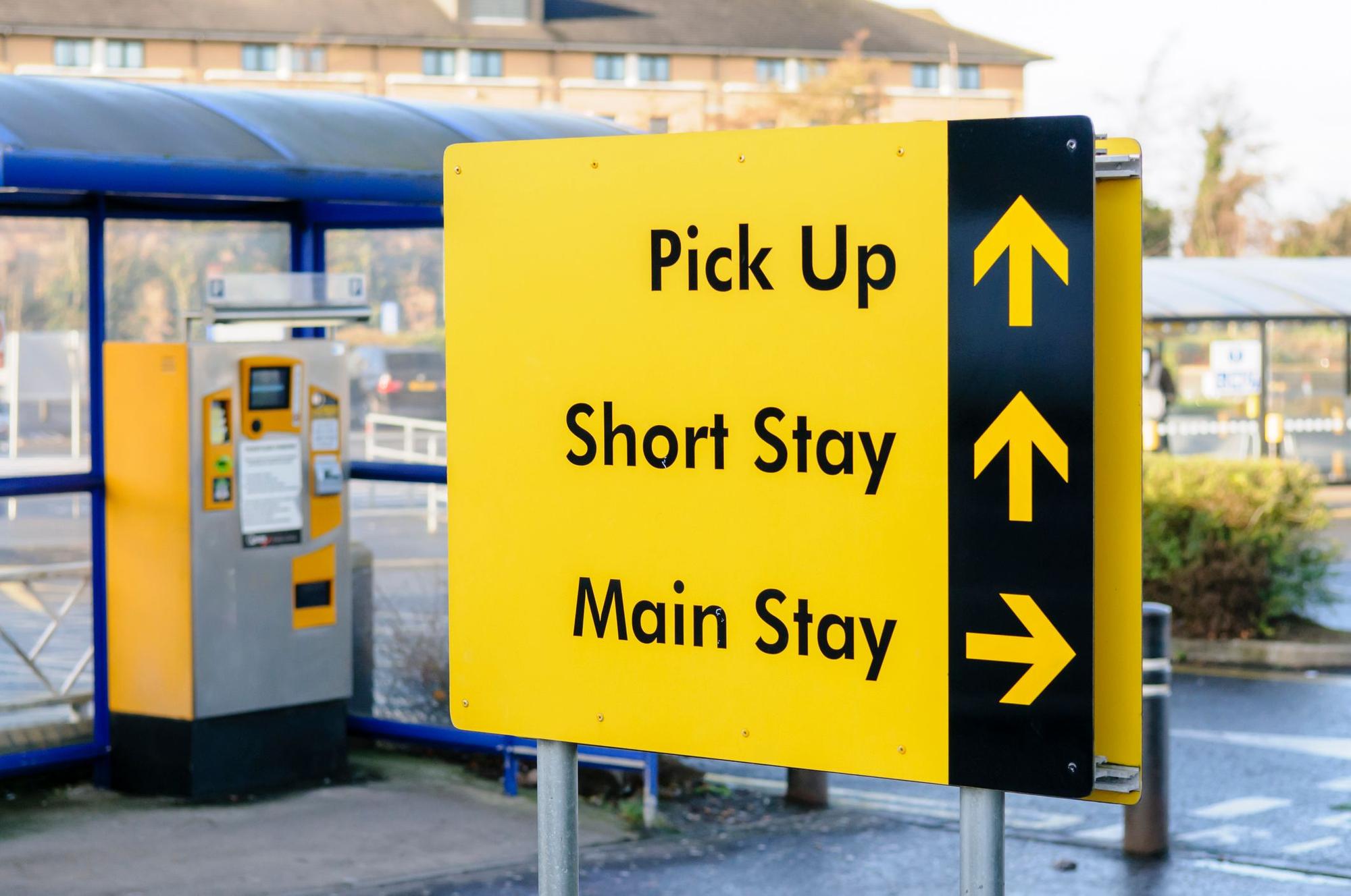Sign to the pick up area, short stay and main stay car parks at Belfast International Airport
