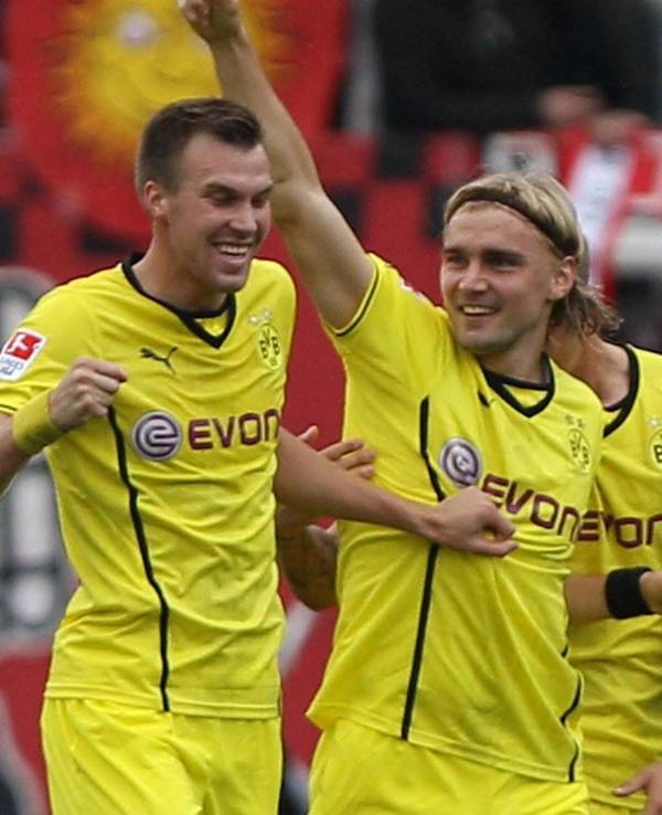 Marco Reus, Kevin Großkreutz und Marcel Schmelzer jubeln gemeinsam.