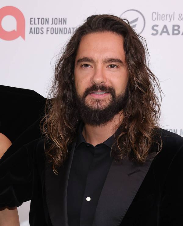 Heidi Klum und Tom Kaulitz lächeln in die Kamera.