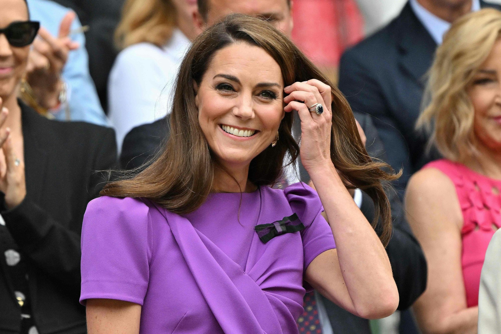 Britain's Catherine, Princess of Wales reacts as she arrives in the Royal Box on Centre Court to attend the men's singles final tennis match on the fourteenth day of the 2024 Wimbledon Championships at The All England Lawn Tennis and Croquet Club in Wimbledon, southwest London, on July 14, 2024. (Photo by ANDREJ ISAKOVIC / AFP) / RESTRICTED TO EDITORIAL USE