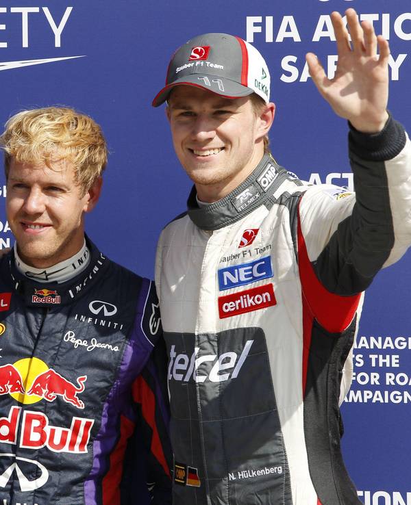 Mark Webber, Sebastian Vettel und Nico Hülkenberg posieren für ein Foto.