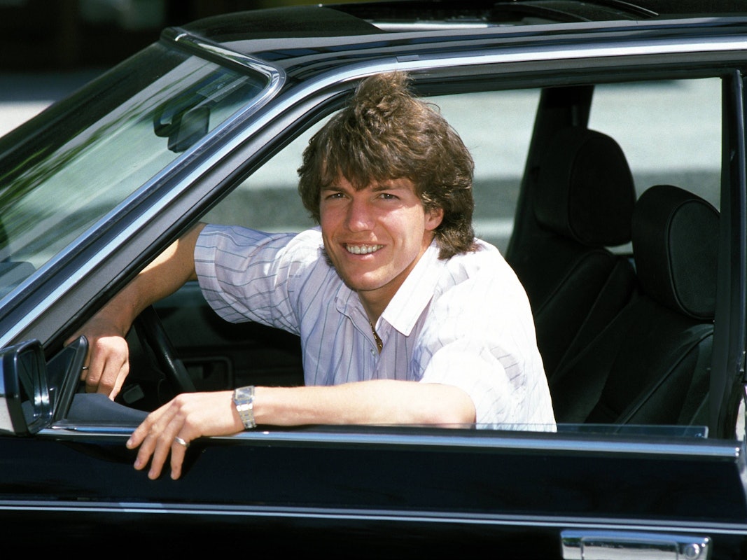 Lothar Matthäus posiert in einem BMW.