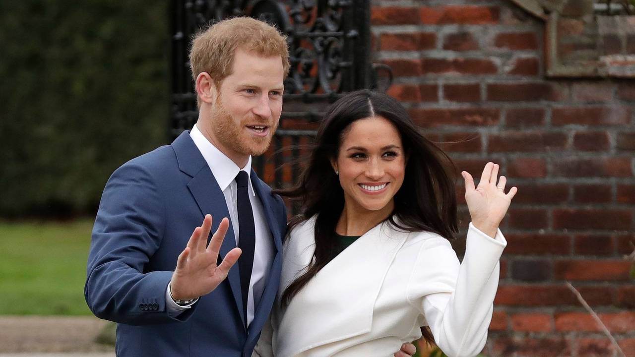 FILE - Britain's Prince Harry and his fiancee Meghan Markle pose for photographers during a photocall in the grounds of Kensington Palace in London, Monday Nov. 27, 2017. (AP Photo/Matt Dunham, File)