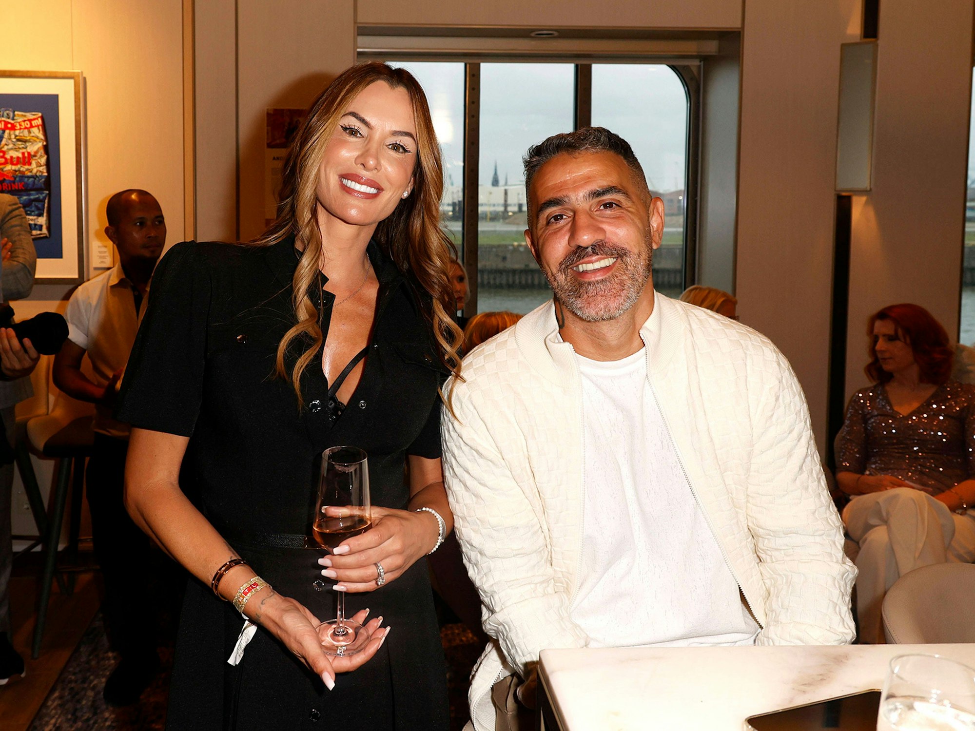 Bushido und seine Ehefrau Anna-Maria Ferchichi lachen