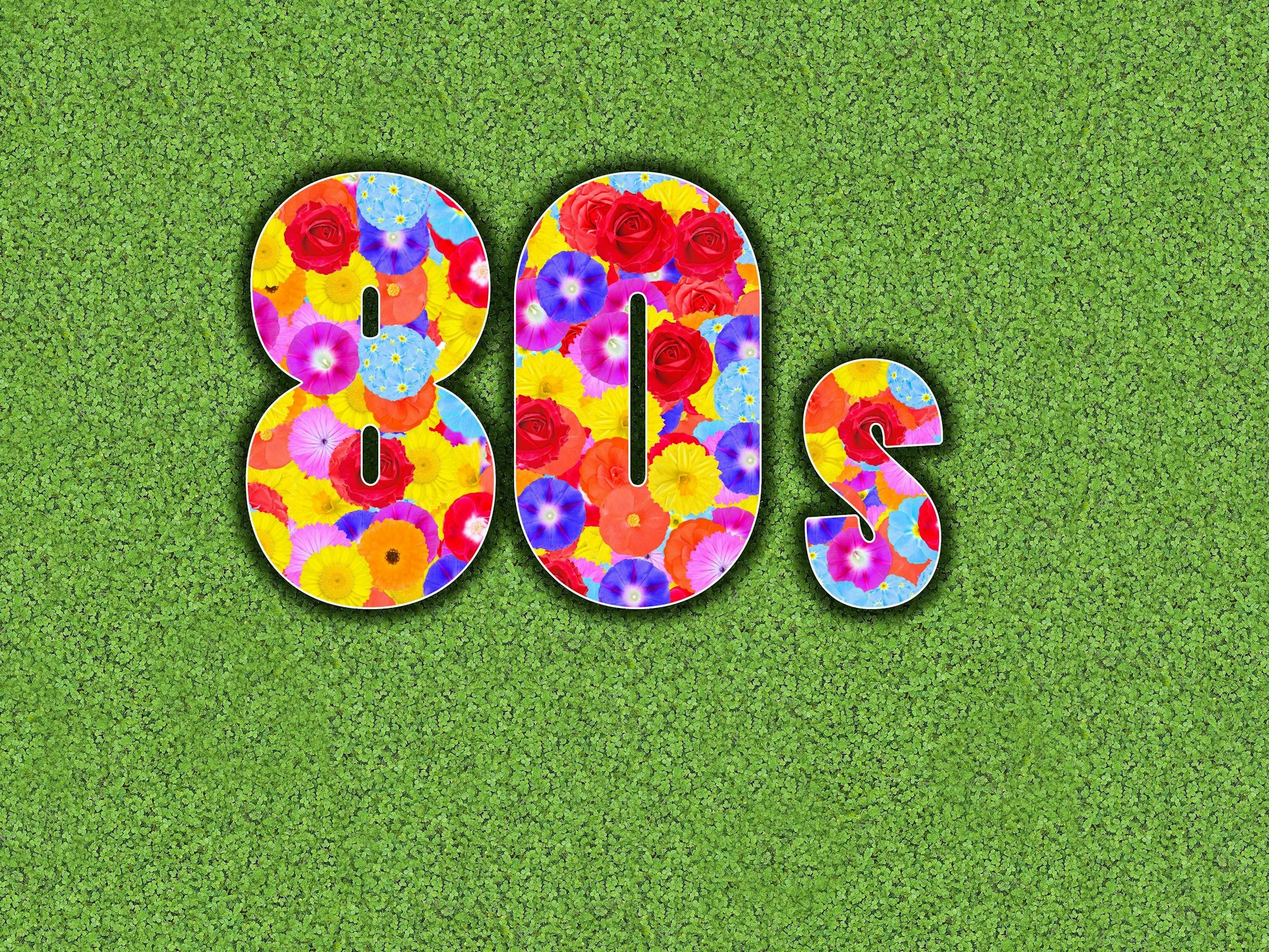 Achtziger Jahre, 80s, 1980s, mit bunten Blumen geschrieben auf grünem Hintergrund