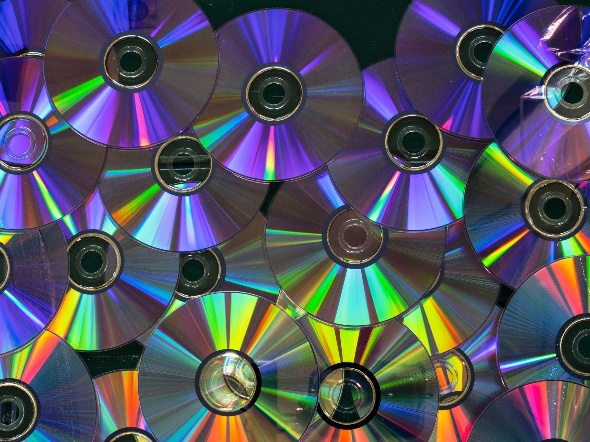 A collection of CDs with a rainbow effect A collection of CDs with a rainbow effect.
