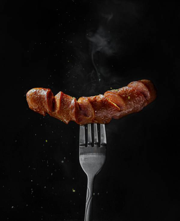 Bratwurst auf einer Gabel