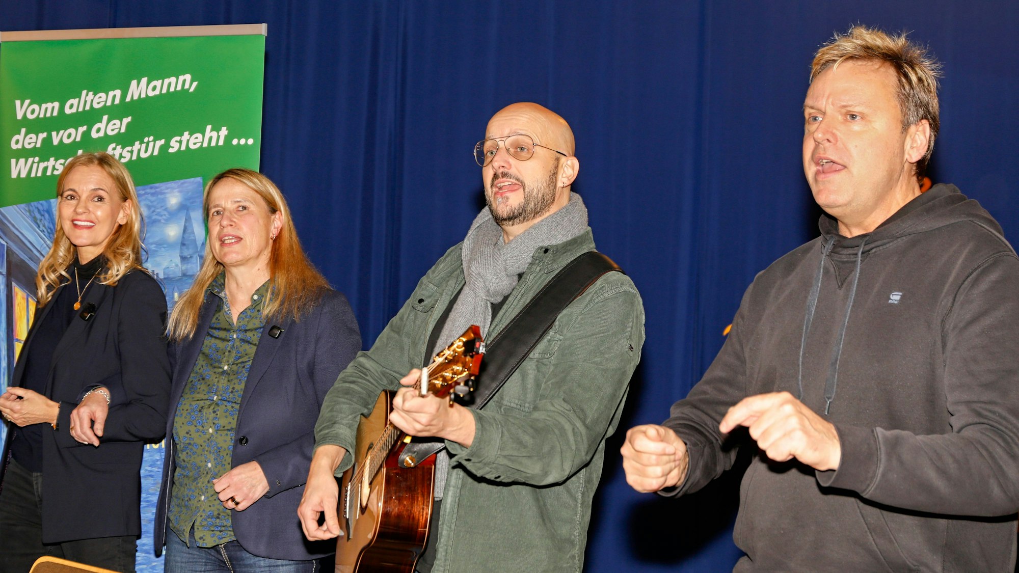 Bläck Fööss singen bei Roman-Vorstellung.