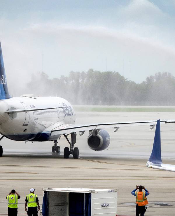 The first regularly scheduled flight to Cuba taxies under the firefighter's spray on the tarmac at Fort Lauderdale International Airport in Florida, USA, 31 August 2016.
