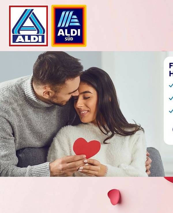 Zwei Verliebte halten ein Herz in der Hand und schauen sich gegenseitig an.