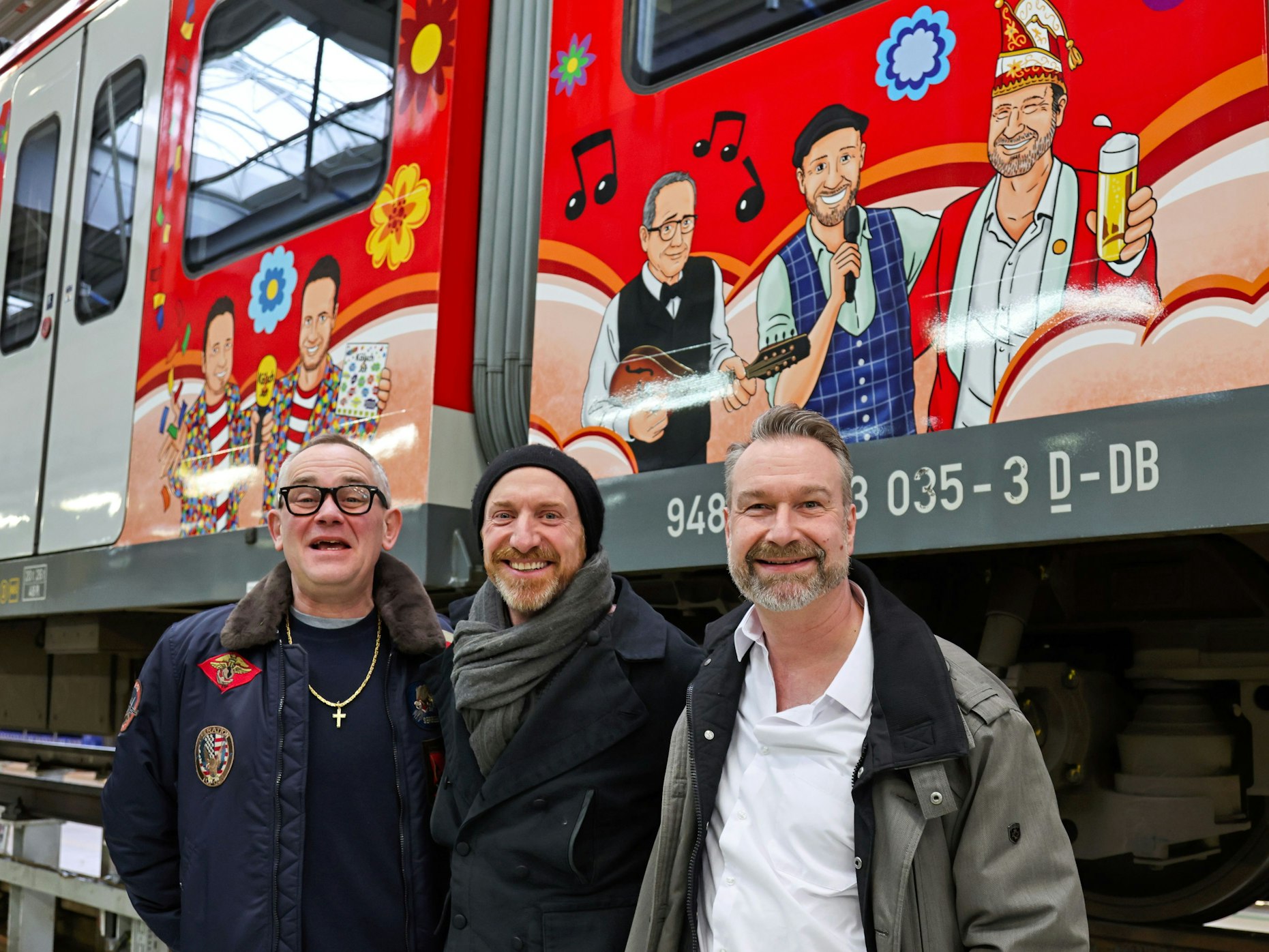 JP Weber, Martin Schopps und Sitzungspräsident Volker Weininger vor dem Karnevalszug.