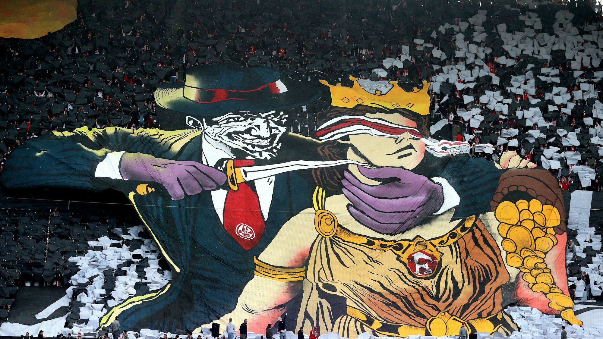 Choreo der FC-Fans: Glücksgöttin Fortuna wird mit einem Messer bedroht: