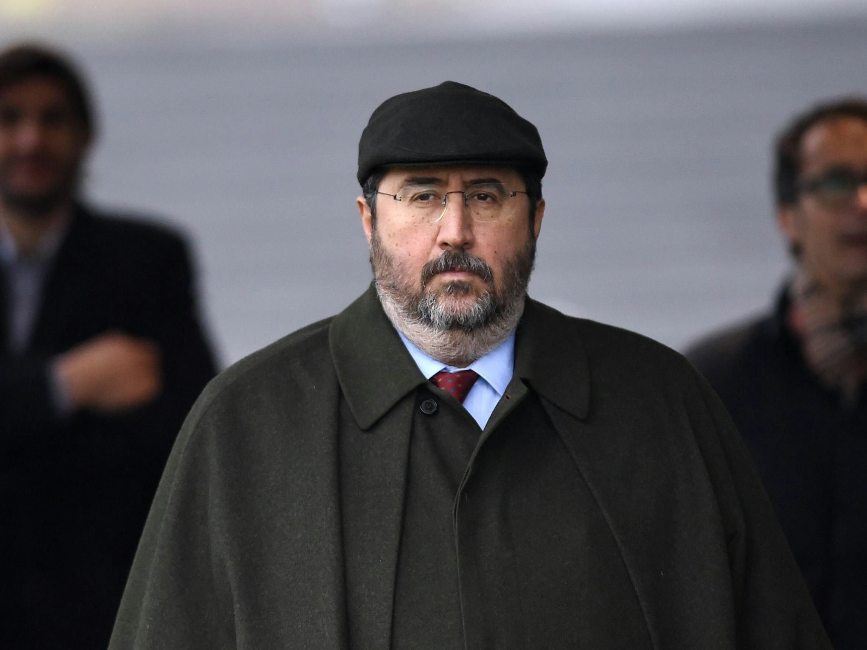 Giovanni Branchini mit schwarzer Schiebermütze.