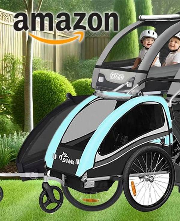 Kinder Fahrradanhänger verschiedener Marken vor einem grünen Garten im Hintergrund.