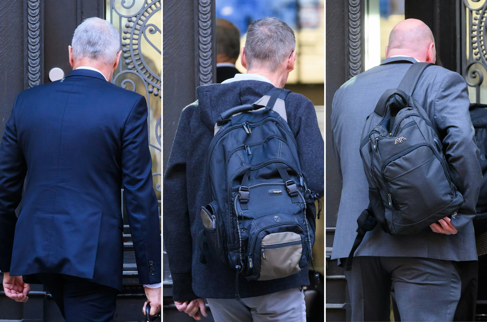 Drei der vier Angeklagten im Prozess um den VW-Abgasskandal stehen vor dem Eingang des Landgerichts Braunschweig.