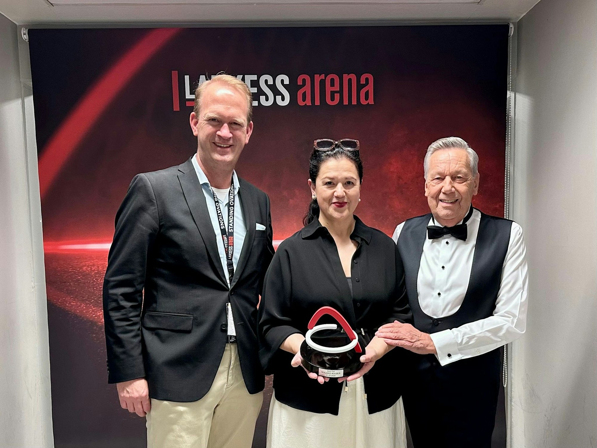 Stefan Löcher mit Viviane Kube und Roland Kaiser.
