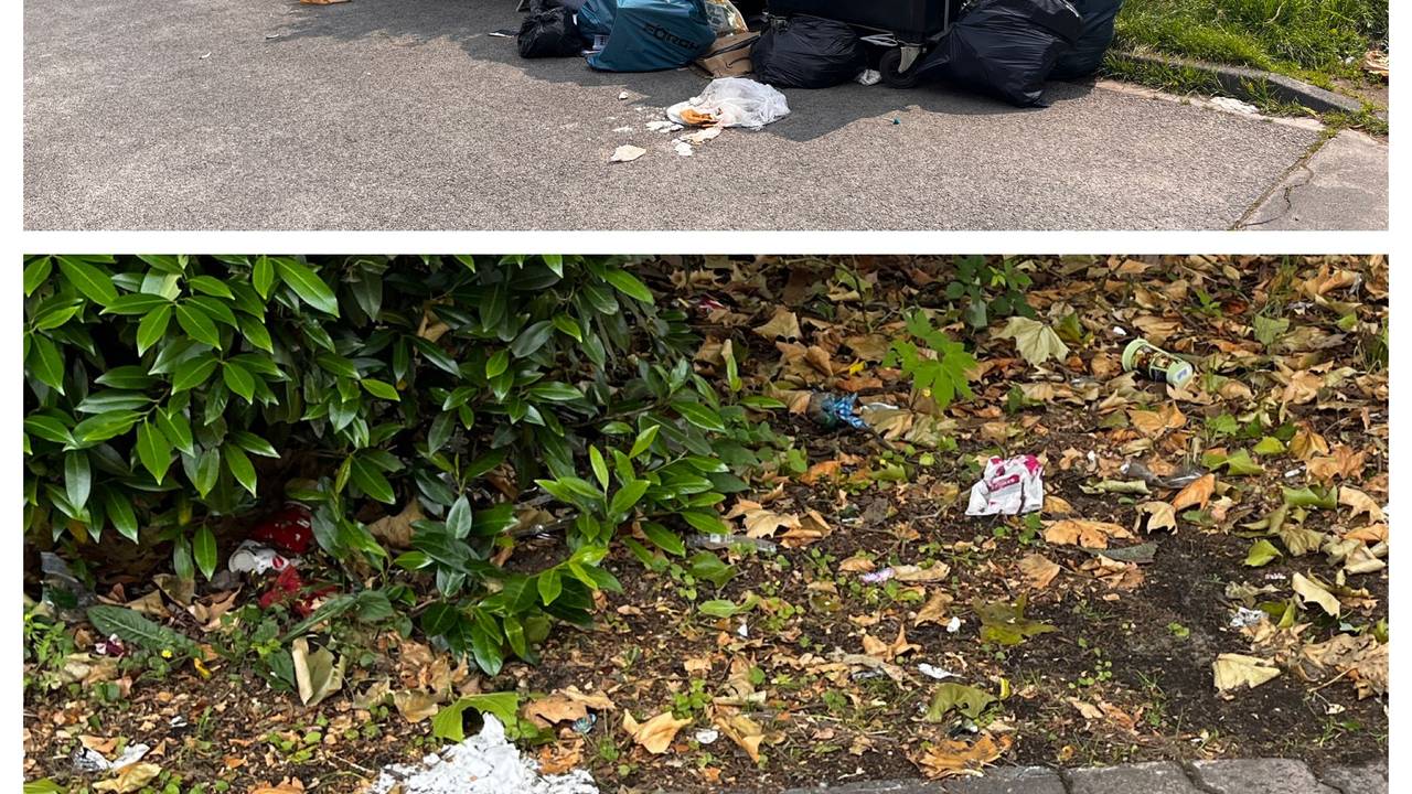 Überfüllte Mülltonnen am Straßenrand.