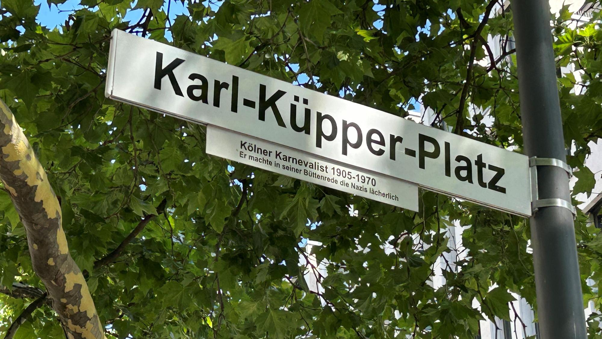 Straßenschild am Karl-Küpper-Platz in Köln.