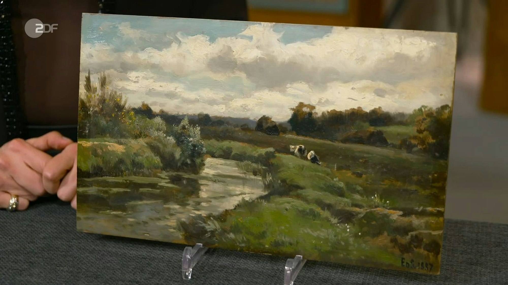 Das Öl auf Holz Gemälde von Edmond de Schampheleer aus dem Jahr 1887 wurde auf 500 bis 700 Euro geschätzt. Jan Cizek gab 500 Euro für das idyllische Landschaftsbild aus.
(Bild: ZDF)