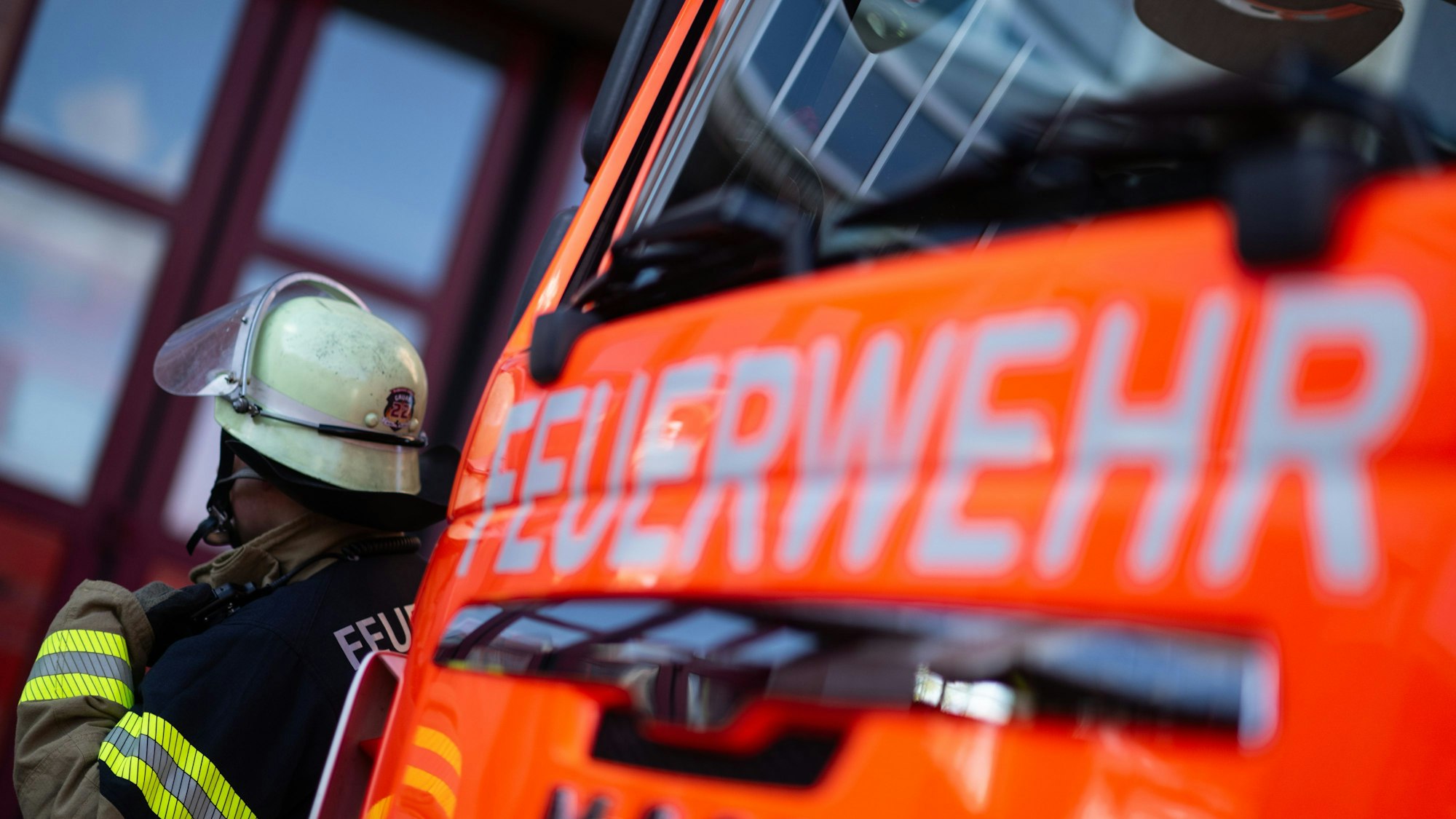 Firefighter with orange fire truck