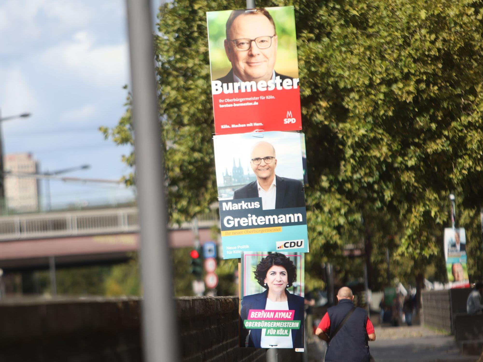 SPD, CDU und die Grünen mit Wahlplakaten zur OB-Wahl in Köln