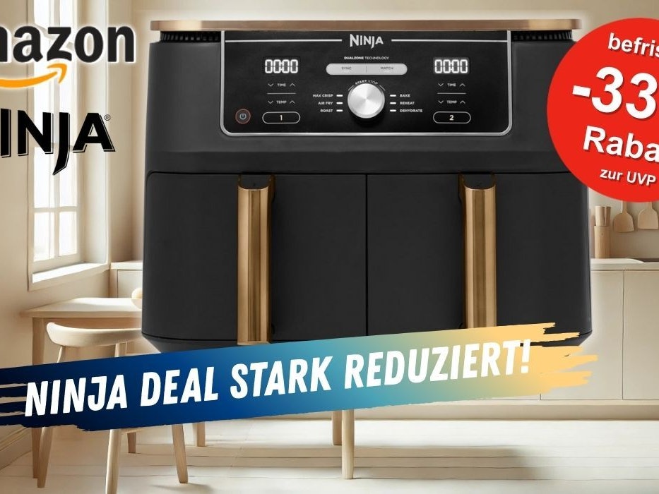 Heißluftfritteuse NINJA Foodi Max Dual Zone Airfryer in Schwarz-Kupfer Design vor einer gut aufgeräumten Küche im Hintergrund.