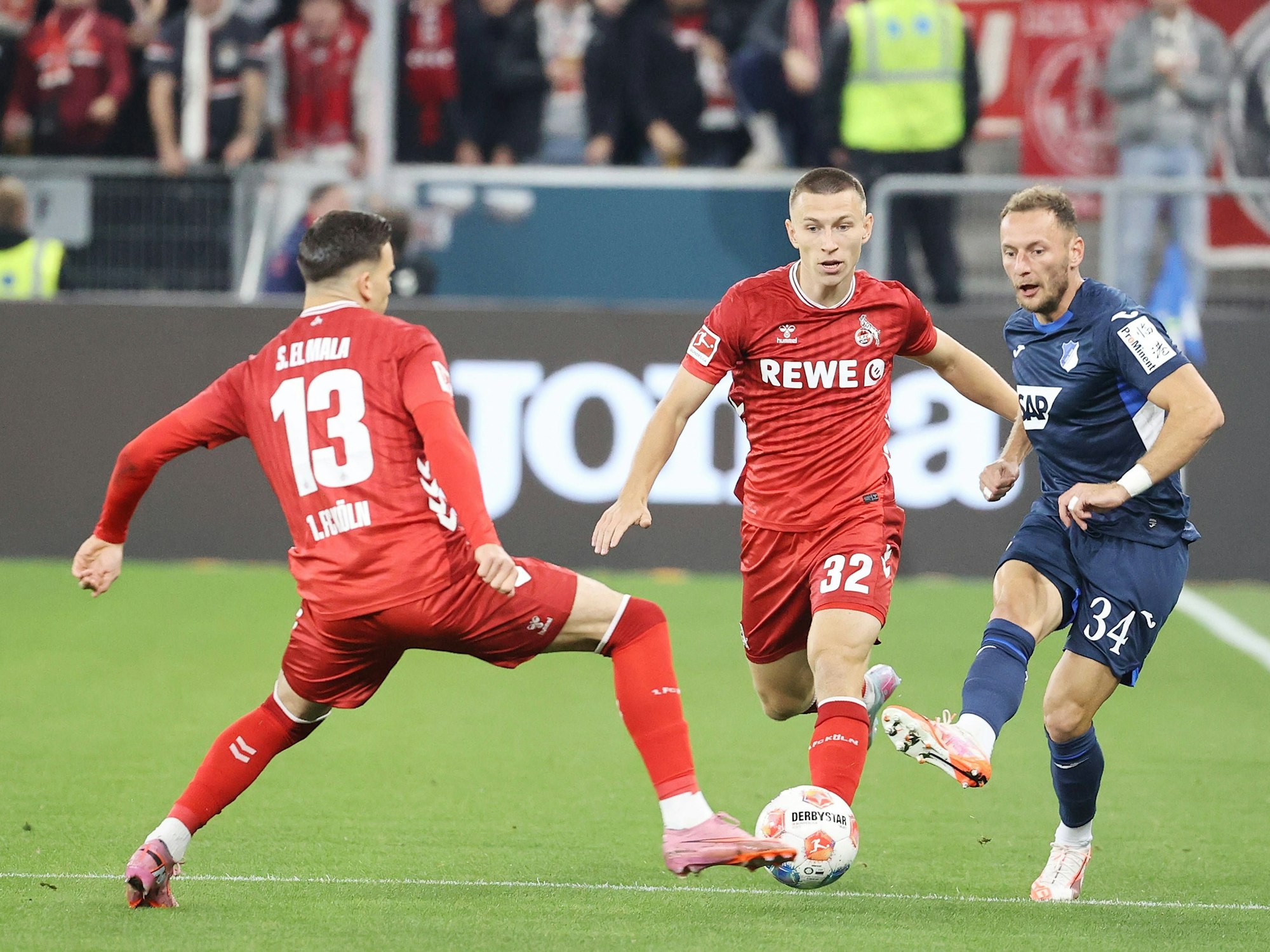 Kölns Said El Mala und Kristoffer Lund gegen Hoffenheims Vladimir Coufal.