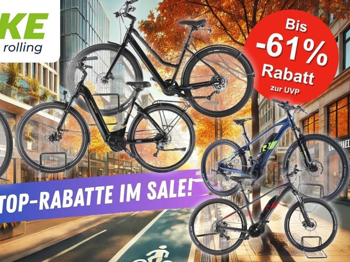 E-Mountain-Bikes, Trekking Bikes und City-E-Bikes vor einer herbstlichen Innenstadt-Kulisse. Mehrere bekannte E-Bike Marken und Hersteller sind vertreten.