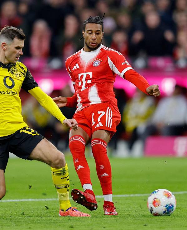Pascal Groß im Zweikampf mit Michael Olise.