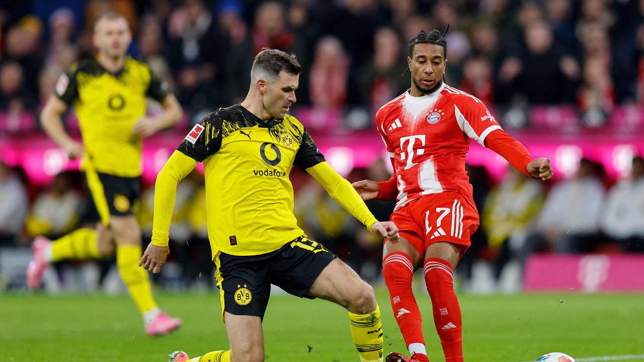 Pascal Groß im Zweikampf mit Michael Olise.