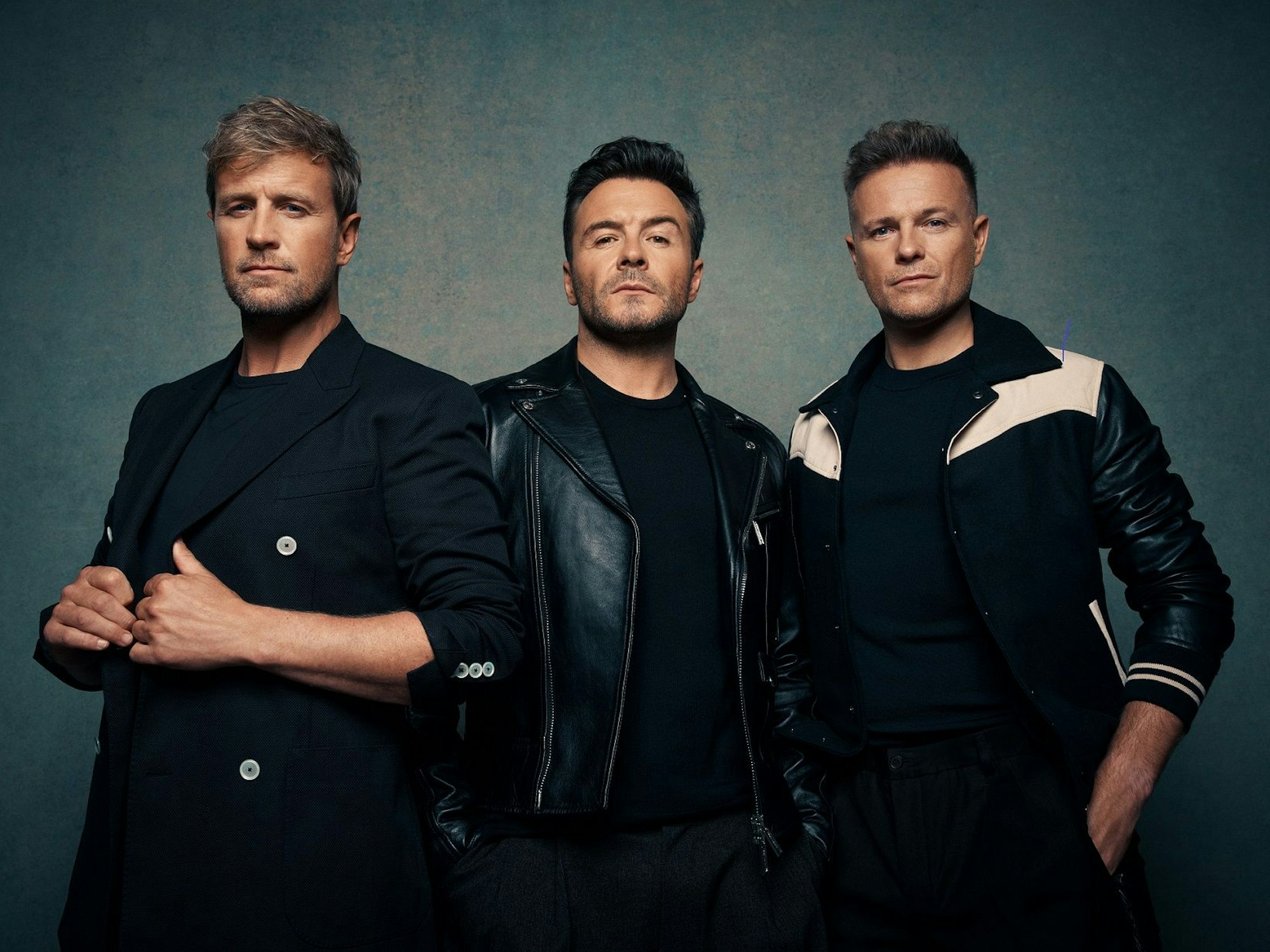 Drei Mitglieder der Band Westlife.