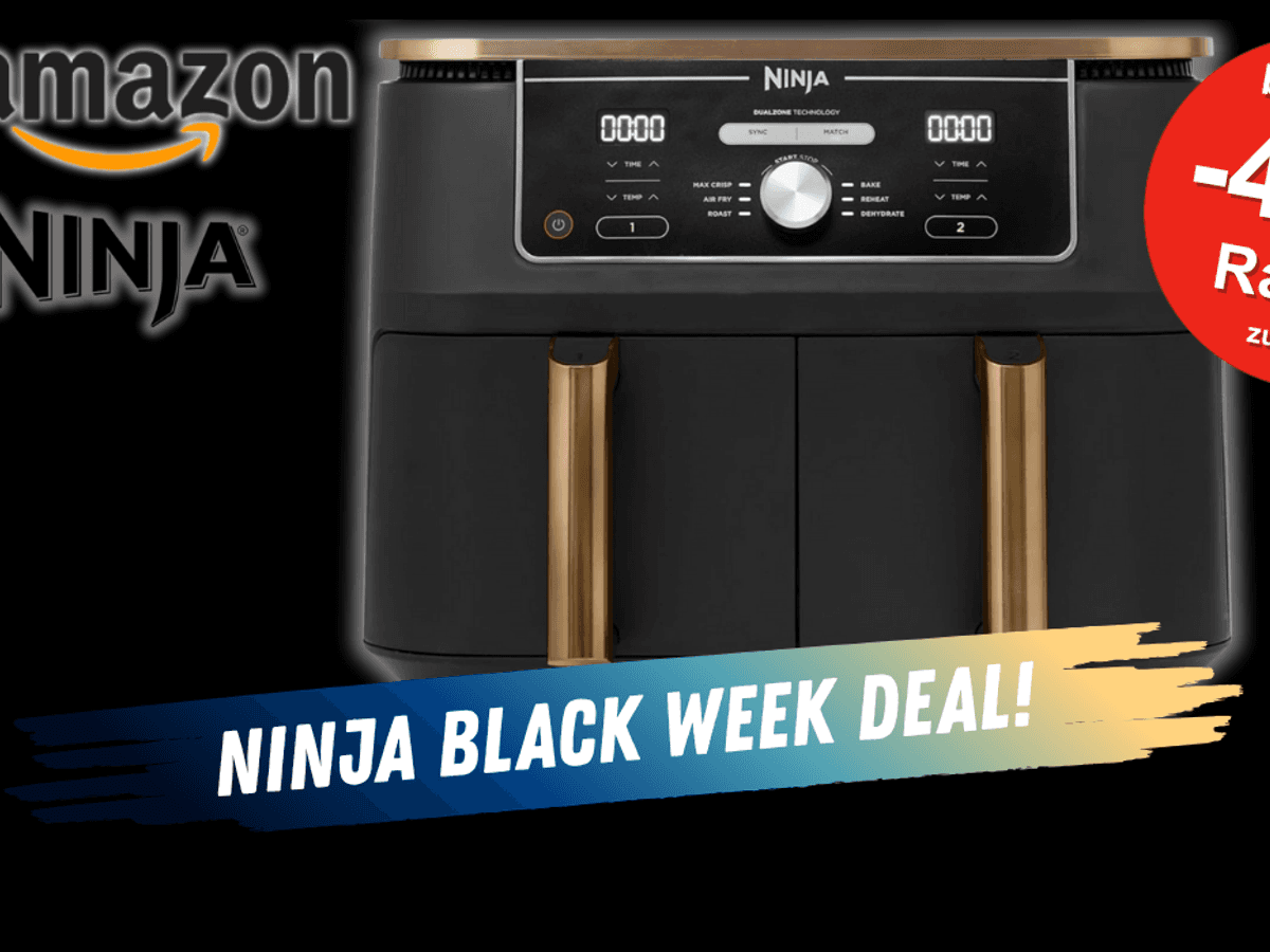 Heißluftfritteuse NINJA Foodi Max Dual Zone Airfryer in Schwarz-Kupfer Design vor einer gut aufgeräumten Küche im Hintergrund.