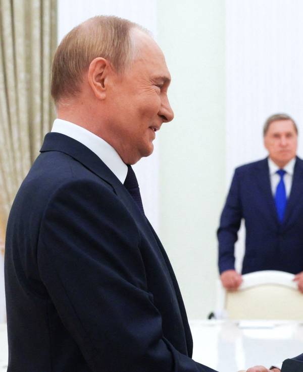 In this pool photograph distributed by the Russian state agency Sputnik, Russia's President Vladimir Putin greets US Special Envoy Steve Witkoff prior to their talks in Moscow on August 6, 2025. (Photo by Gavriil Grigorov / POOL / AFP)
