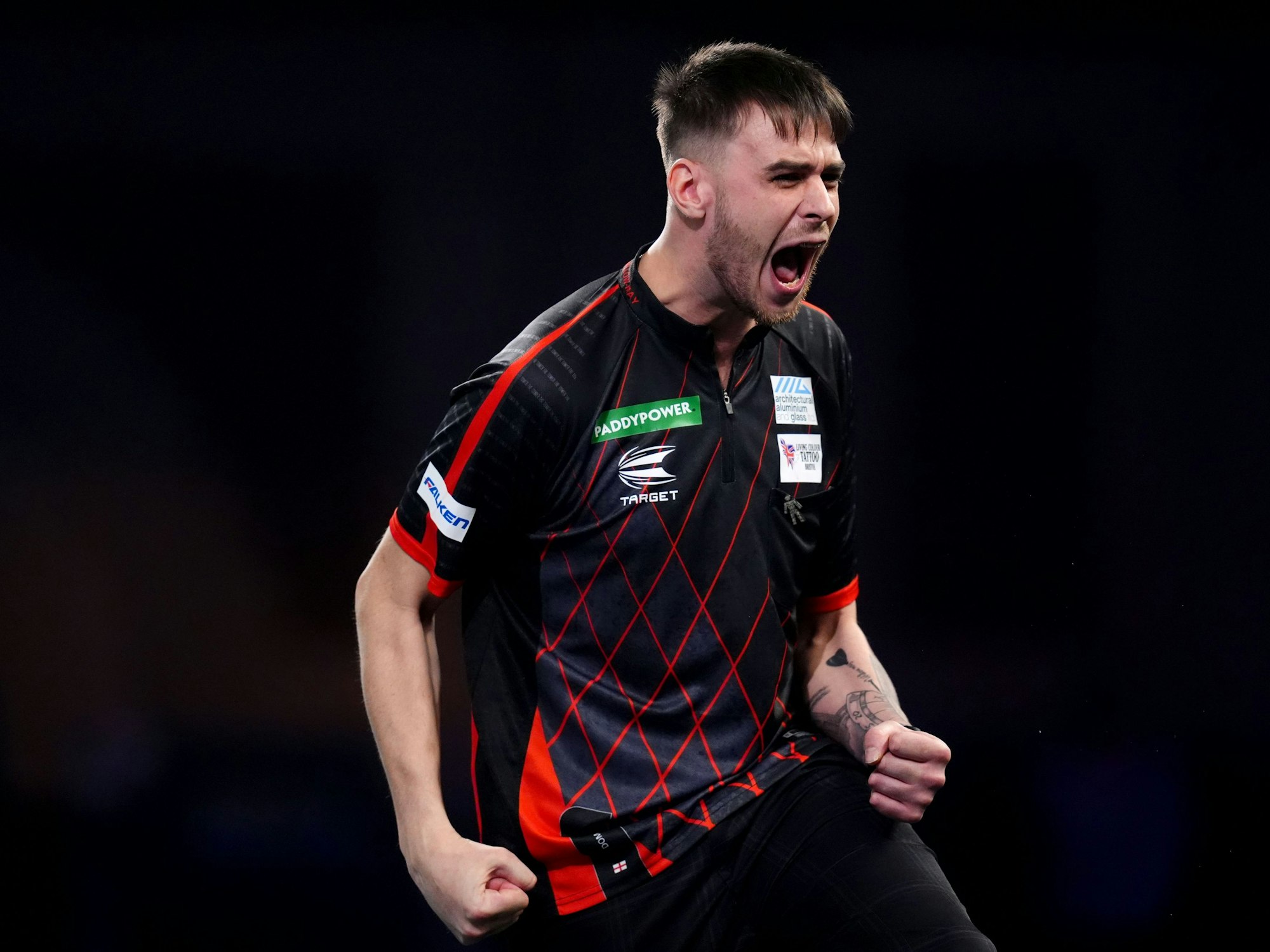 Dom Taylor reagiert während seines Spiels am vierten Tag der Paddy Power World Darts Championship im Alexandra Palace.