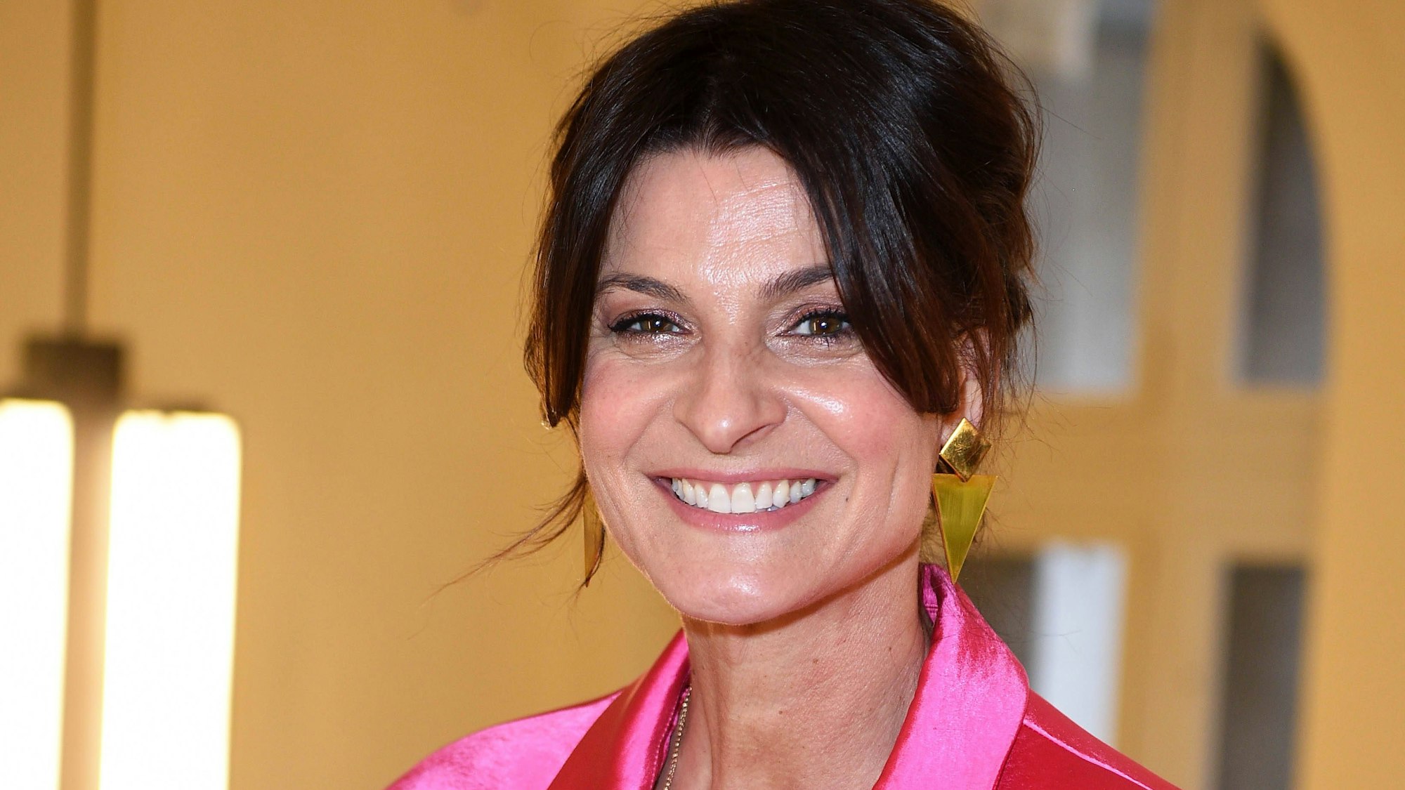 Marlene Lufen lächelt in pinker Oberbekleidung