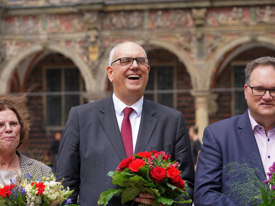 Kristina Vogt, Andreas Bovenschulte und ein Mann