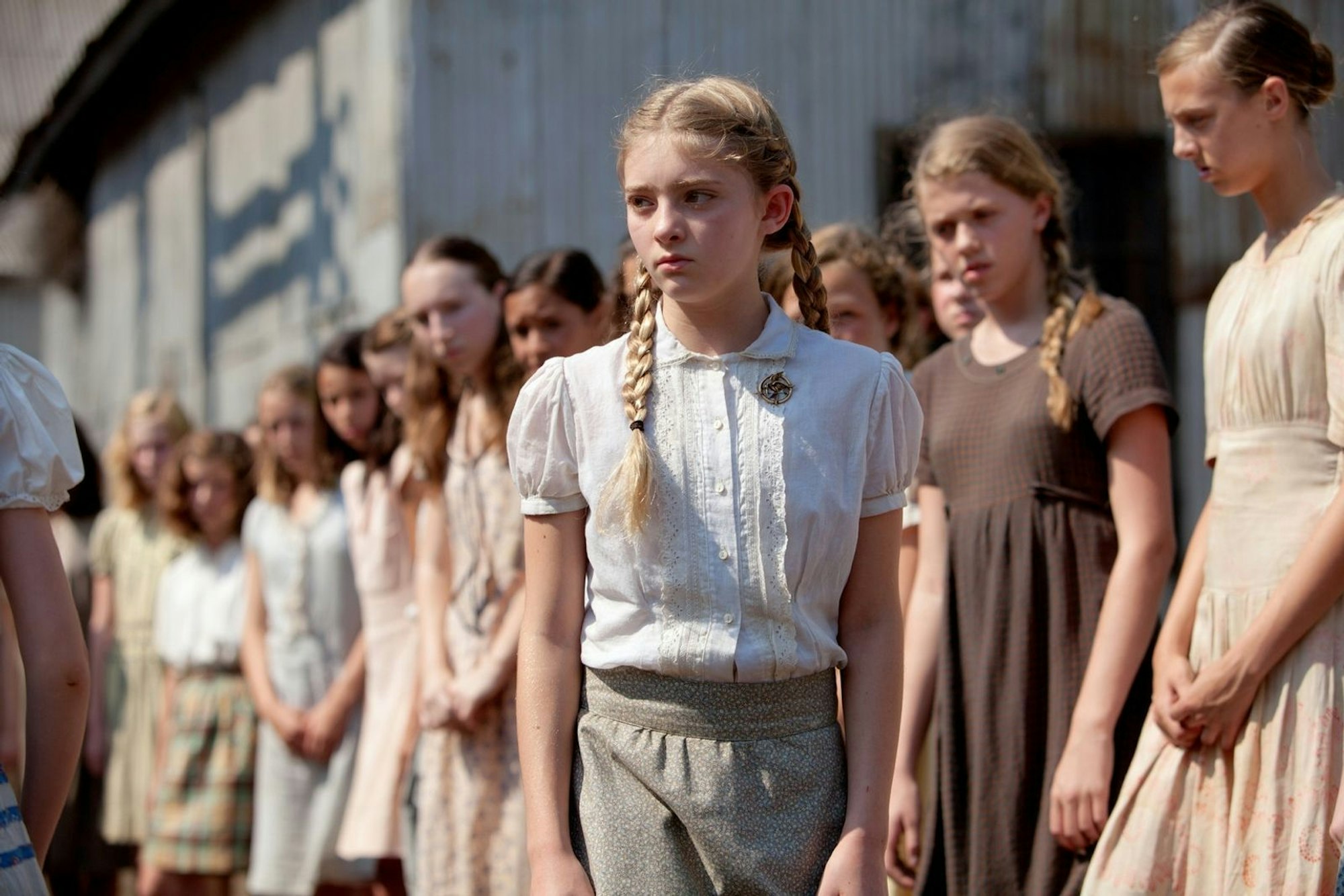 Für ihre kleine Schwester Primrose (Willow Shields, Bild) opfert sich Katniss Everdeen freiwillig für die Hungerspiele. (Bild: Studiocanal GmbH)