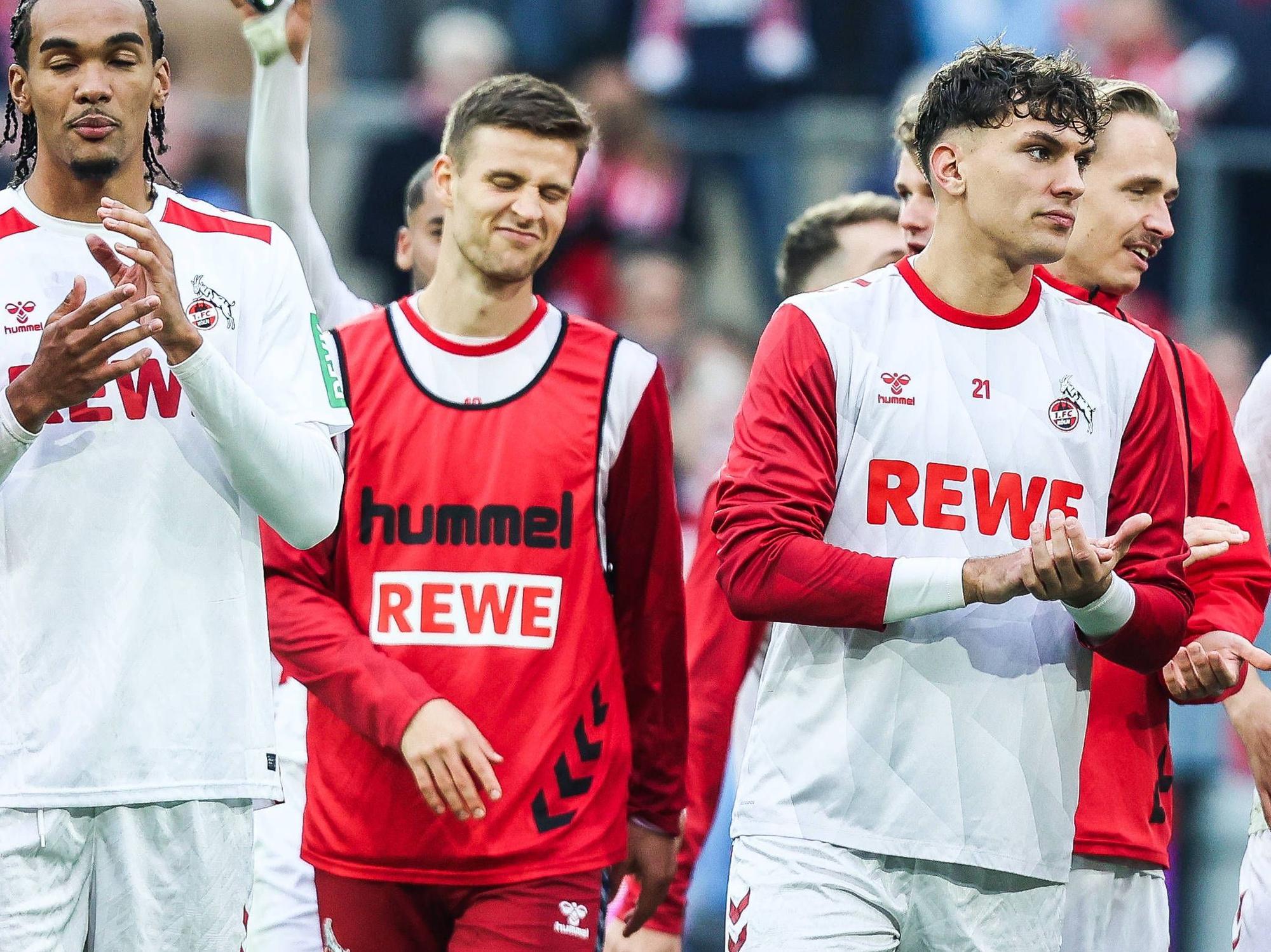 Damion Downs, Rasmus Carstensen und Julian Pauli nach einem Spiel des 1. FC Köln.