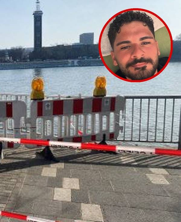 Am Rhein ist der Bereich an einem Gitter abgesperrt worden, unter anderem durch Polizei-Flatterband.