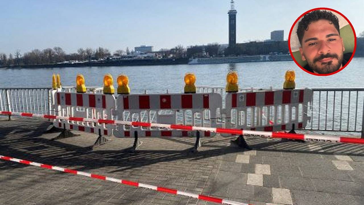 Am Rhein ist der Bereich an einem Gitter abgesperrt worden, unter anderem durch Polizei-Flatterband.