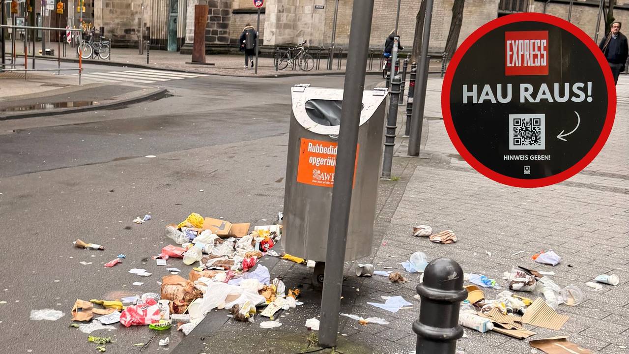Auf der Breite Straße in Köln liegt Müll um einen Abfalleimer herum verteilt (Archivfoto).
