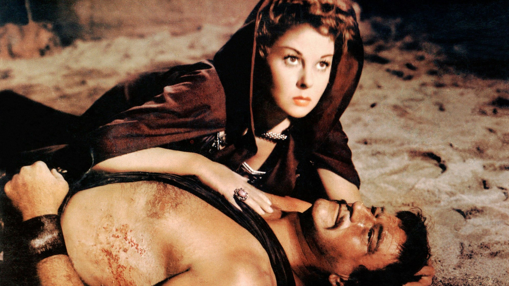 Susan Hayward und John Wayne in einer Filmszene im Wüstensand, der möglicherweise radioaktiv belastet war.