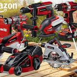 Collage verschiedener roter Einhell-Geräte – darunter Akkubohrschrauber, Winkelschleifer, Stichsäge, Kreissäge, Rasenmäher und Rasentrimmer – vor einem sonnigen Gartenhintergrund mit Tulpen und Holzdielen. Amazon-Logo und roter Sale-Button mit der Aufschrift „Bis -35% Rabatt zur UVP" sichtbar.