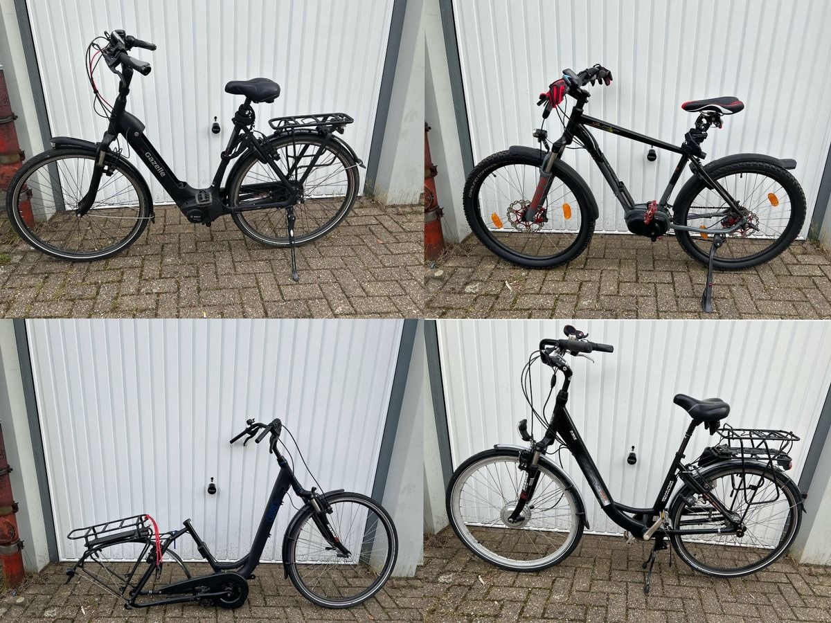 Mehrere Fahrräder stehen in einer Garage.